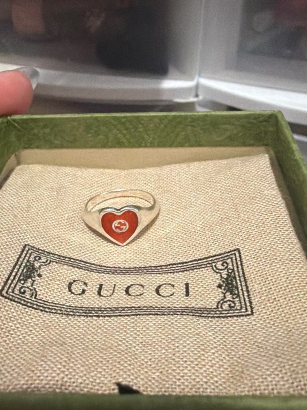 Ring on branded pouch